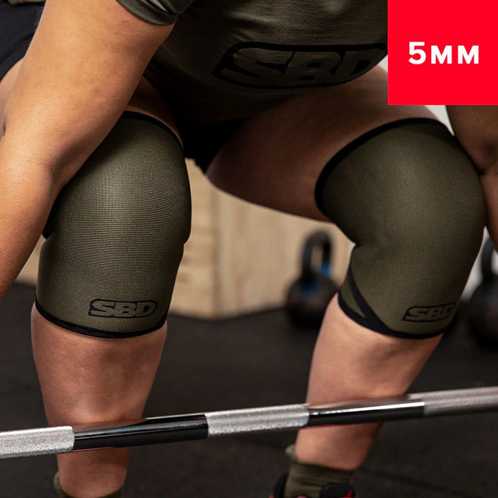 Athlete bent down to snatch wearing SBD Endure Weightlifting Knee Sleeves - made in Sheffield, high-grade neoprene for elite strength - mid range view